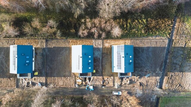 Eco-friendly houses with rooftop solar panels