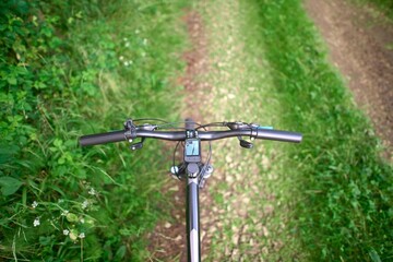 Action biking in woods with GPS view