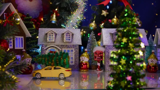 Yellow cars take turns approaching the houses, and the orange one stops in the center of the town
