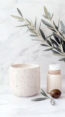 A serene spa and wellness scene featuring a speckled candle, a lotion bottle, an olive, and an olive branch on a white marble background.