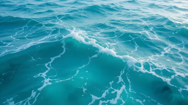 Vibrant Turquoise Ocean Waves with White Foam. Dynamic Blue Sea Water Texture and Natural Movement.