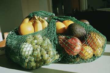 Top-down flat lay of green eco-friendly produce bags, neatly arranged on neutral background, highlighting sustainable shopping, reusable materials, clean minimalist composition.