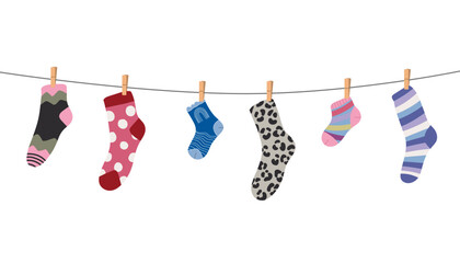 Wool and cotton socks hanging on a rope with clothespins, decorated with playful textures and patterns, perfect for laundry, kids clothing and cozy home decor projects.