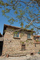 Architectural structures with stone walls. Historic houses in Birgi Village, Ödemiş, Izmir. Historic stone houses in Birgi Village. Türkiye.