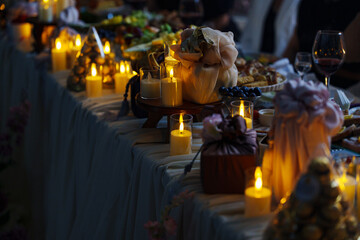 Elegant dinner setting with candles and delicious food