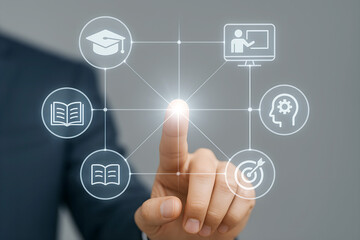 Hand touching glowing digital network of education icons