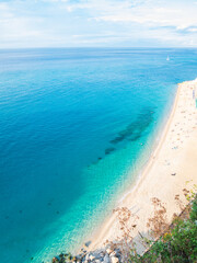 Tropea Calabria Italy. Turquoise sea, sunny beach, vibrant summer colors view from the cliffs above.