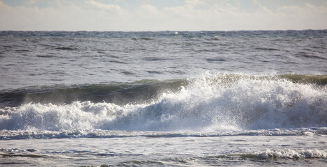 The ocean is calm and the waves are small