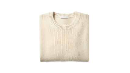 Folded cream colored knit pullover garment sits isolated against a dark background