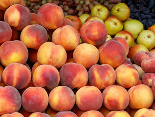 A pile of peaches and apples
