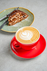 Enjoying a rich cup of coffee alongside a slice of delicious cake in a cheerful cafe atmosphere