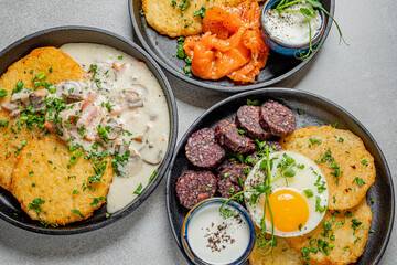 Savor a vibrant breakfast of crispy pancakes, smoked salmon, and black pudding!