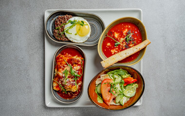 A vibrant array of gourmet meals highlights fresh ingredients and rich flavors