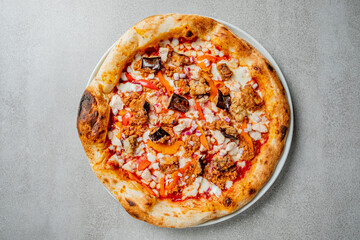 Freshly baked pizza featuring a variety of toppings, ready to be enjoyed at a cozy gathering