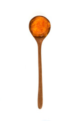 Spoon with pumpkin puree isolated on white background