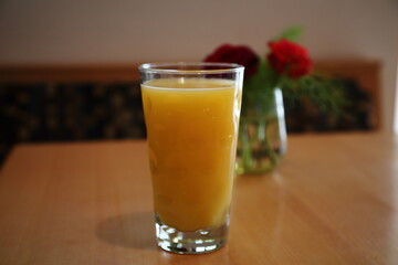 Fresh orange juice on wooden table