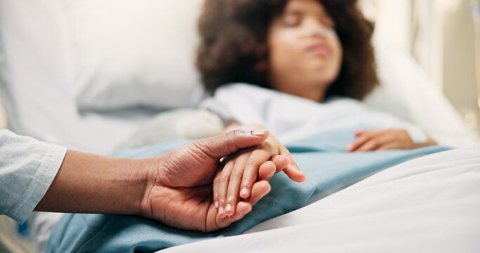 Care, holding hands and parent with child in hospital bed for surgery recovery, healing and support. Healthcare, medical and family with kid together for comfort, empathy and wellness for operation