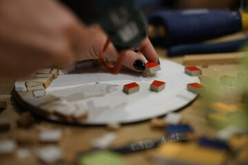 Making colorful mosaic during artistic workshop. Close up. 
