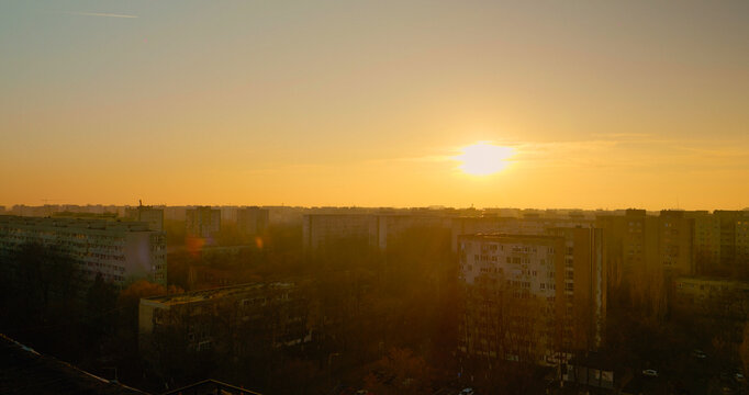 Captivating sunset over urban rooftops reveals a vibrant cityscape - Powered by Adobe