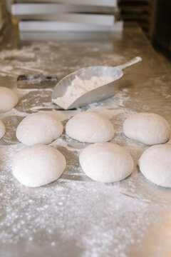 shaping raw sourdough artisan loafs of bread