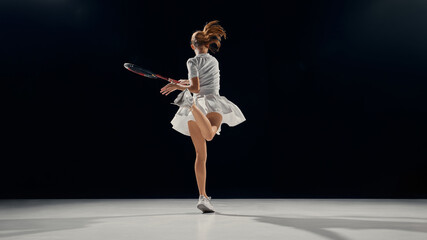 Young tennis player spinning midair with rhythm and physical control. Concept of coaching, body awareness, self-discipline in youth education, promoting focus and balance.
