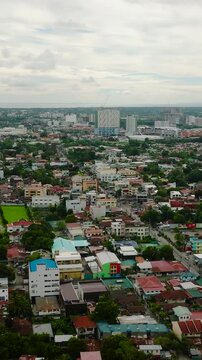 Aerial view of Iloilo City. Commercial buildings and resident area. Panay Island. Philippines. Vertical view.