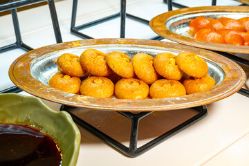 Karisik Turk tatlilari. New dessert varieties at the  luxury hotel open buffet. Milk-based desserts,  Turkish Dessert Sobiyet, havuc dilimi, midye baklava, mussels baklava and classic baklava. 