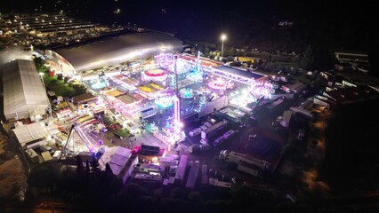 Aerial night view of illuminated amusement park in Portugal