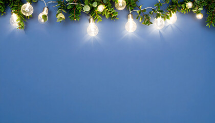 Sophisticated holiday illumination featuring festive string lights and greenery creating a beautiful frame against a classic blue background
