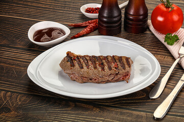 Grilled beef striploin steak with sauce