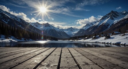 snowy mountain lake with wooden deck and winter cabins under a bright sun