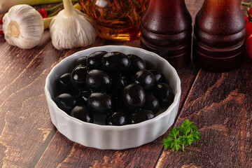 Mediterranean marinated Black olives in the bowl