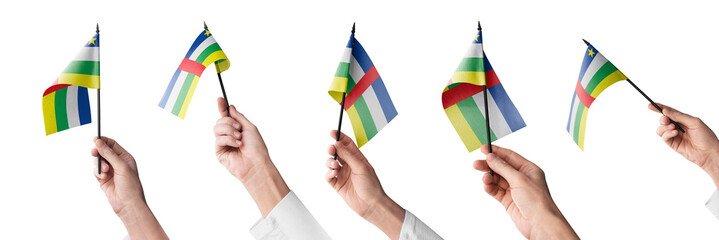The Central African Republic flag in hand in different angles on a white background