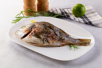 Baked dorada fish with spices