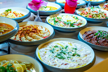 Mediterranean cuisine, olive oil, healthy and delicious  salad varieties with green vegetables.Vegetarian and vegan healty food, open buffet in a luxury hotel. Meze varieties, salad bar.
