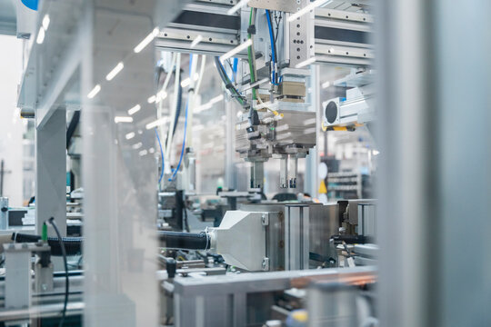 Automated robotic machinery in modern factory for industrial production