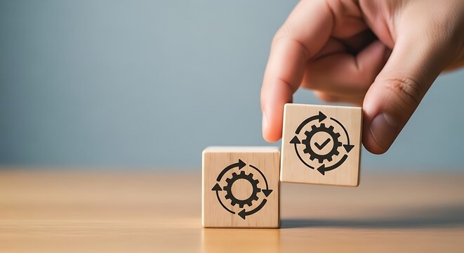 Hand placing wooden cube with gears and checkmark icon, symbolizing workflow and process optimization