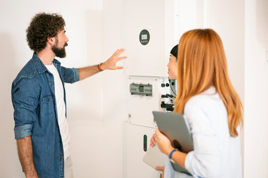 Team consulting on innovative sustainable technology indoors