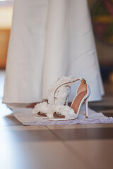 Elegant bridal shoes on the floor before ceremony