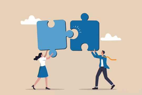 Business team collaboration combining puzzle pieces for success