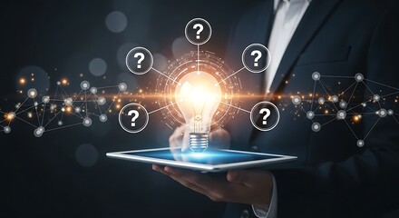 Businessman holding a tablet with a glowing light bulb and question marks symbolizing ideas and problem solving