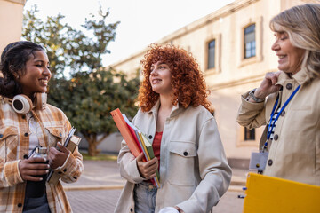 University professor and students discussing outdoors