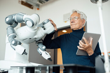 Engineer working with a robot in a laboratory setting