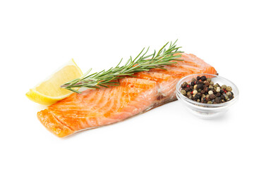 Piece of tasty grilled salmon, peppercorns, rosemary and lemon slice isolated on white
