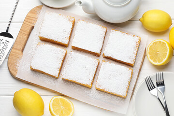 Tasty lemon bars and fresh fruits on white wooden table, flat lay