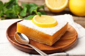 Tasty lemon bar with mint and fresh fruits on table, closeup