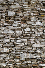 Stone walls of historical buildings. Stone walls of old wooden buildings. Stone-built architecture. Stone walls of historical Birgi houses in the Ödemiş district. Türkiye.