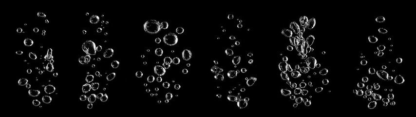 Multiple streams of crystal-clear water bubbles rising on a black background, idea for purity, freshness, clarity, wellness, and beverage concepts, perfect for commercial design modern advertising