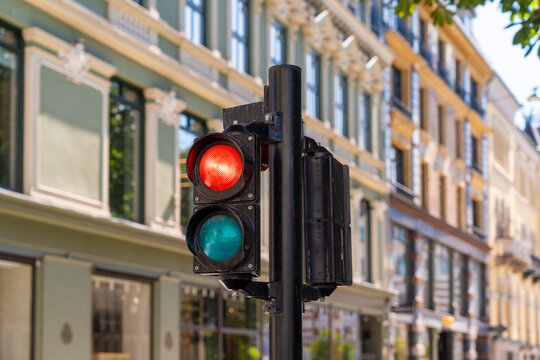 Red traffic light in Oslo city street on sunny summer day in Norway