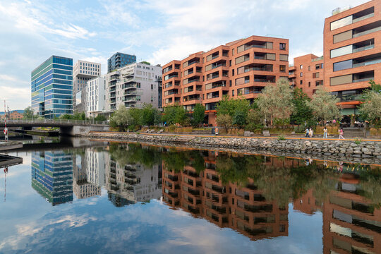 Modern architecture and canal with reflections in Oslo Norway on a summer day